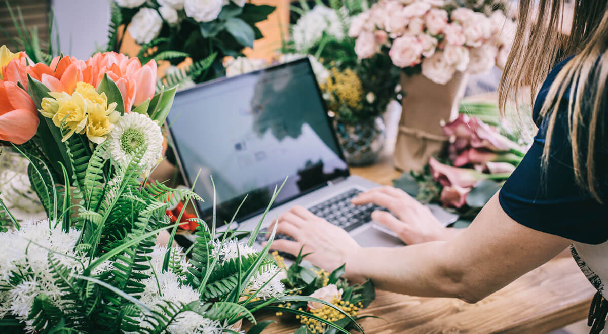 florist using interface of online flower shop