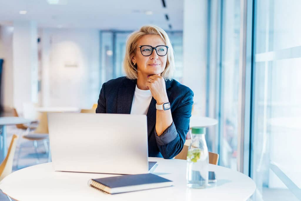 businesswoman looking at the window